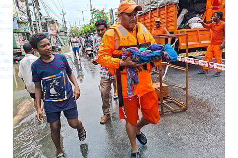 Flood in Vijayawada: NDRF men evacuate an infant from a flood -hit area
